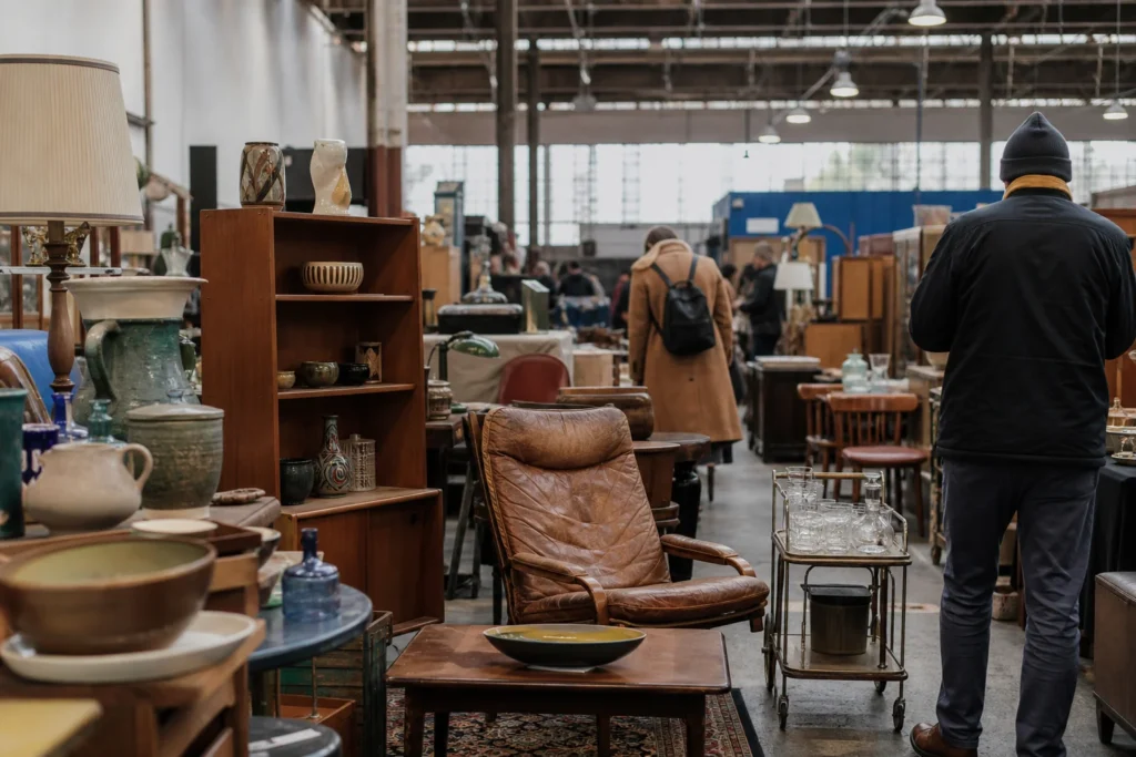 shoppers browsing antique and vintage market stalls at Den Blå Hal in Copenhagen