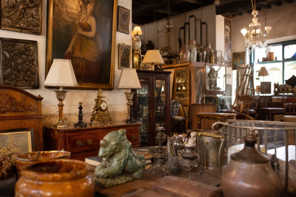 shoppers browsing antique and vintage market stalls at Les Trouvailles de l’Oncle Pierre in France