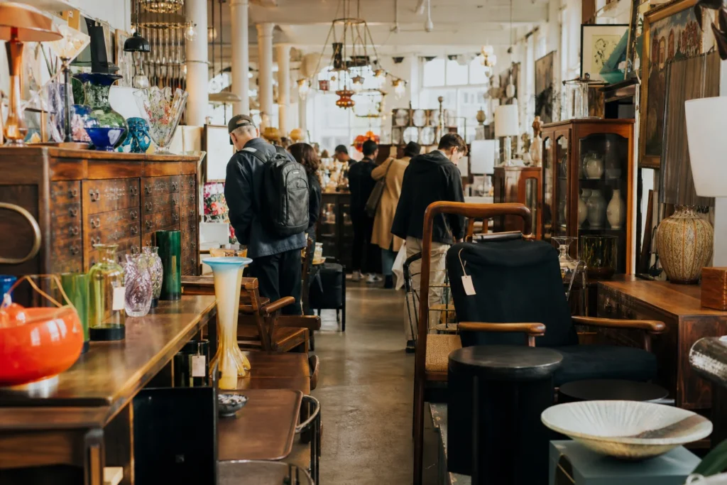 shoppers browsing antique and vintage market stalls at Alfies Antiques Market in London