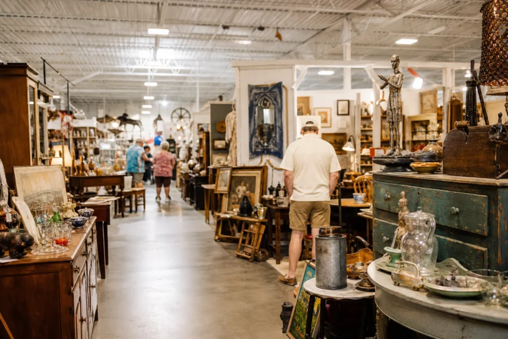 shoppers browsing antique and vintage market stalls at Angel’s Antique and Flea Mall in Alabama