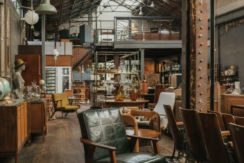 shoppers browsing antique and vintage market stalls at Antiek-Depot in Belgium