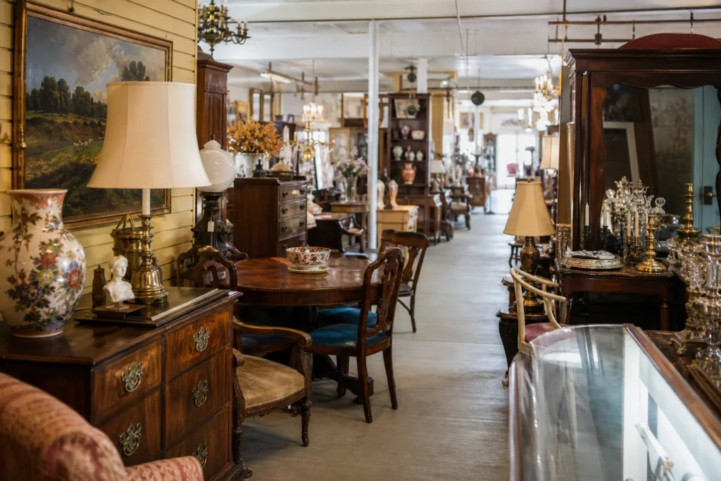 shoppers browsing antique and vintage market stalls at Antique Attic Imports in Alabama