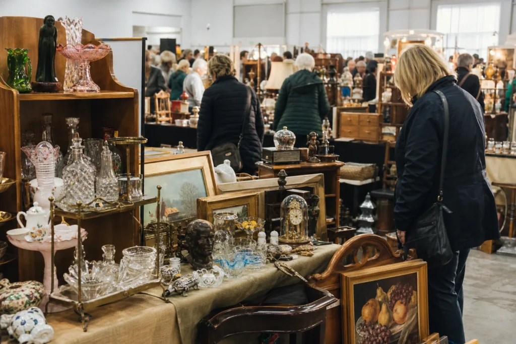 shoppers browsing antique and vintage market stalls at Antique Central Show & Sale in Alberta, Canada