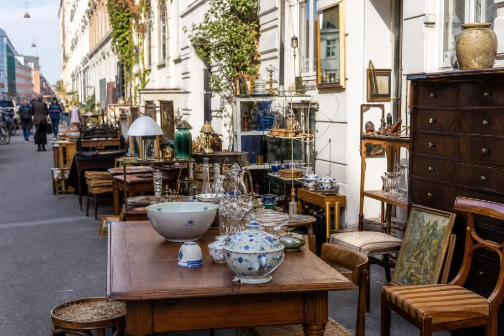 shoppers browsing antique and vintage market stalls at Antique Shops in Ravnsborggade in Copenhagen