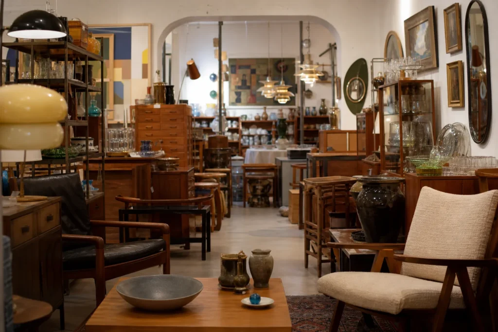 shoppers browsing antique and vintage market stalls at Antique shops in Vasastan in Sweden