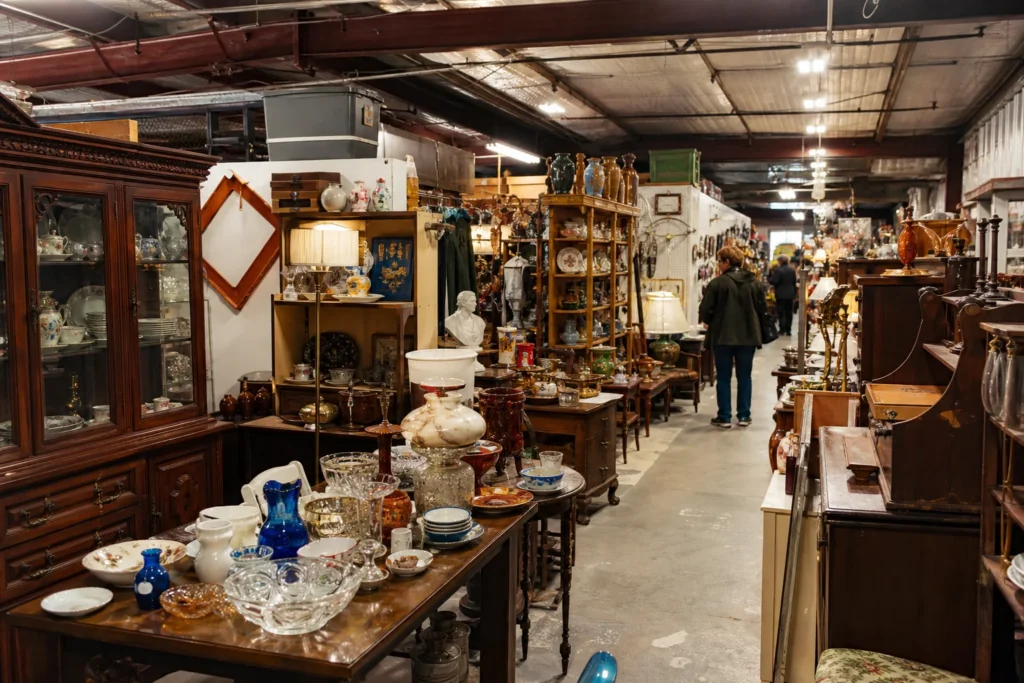 shoppers browsing antique and vintage market stalls at Antiques, Treasures, and More in Alabama