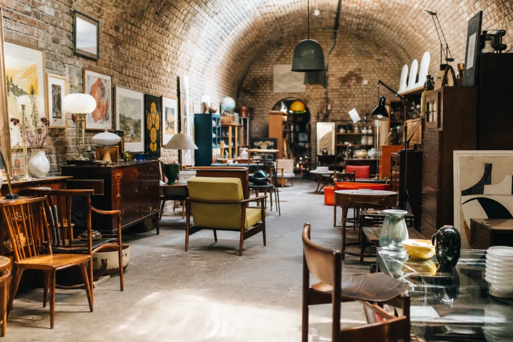 shoppers browsing antique and vintage market stalls at Arch 389 in London
