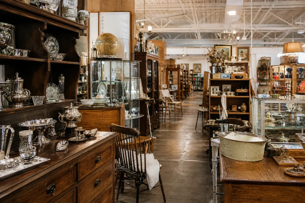 shoppers browsing antique and vintage market stalls at Arkansas Peddlers Antique Mall