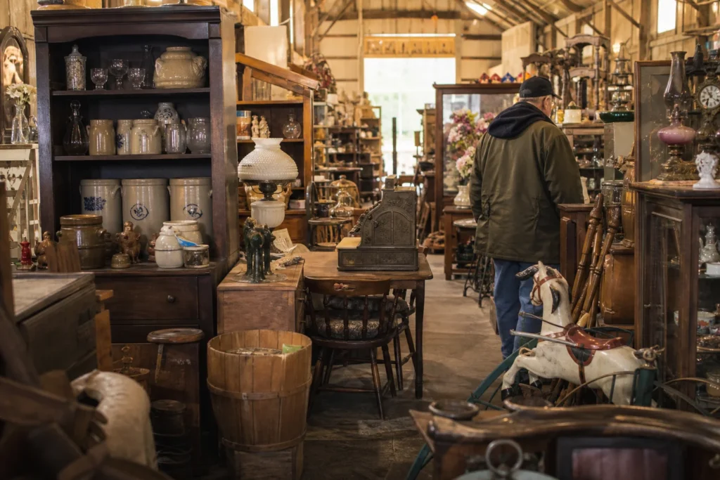 shoppers browsing antique and vintage market stalls at Arlo’s Antique Flea Market and Flower Barn in West Virginia