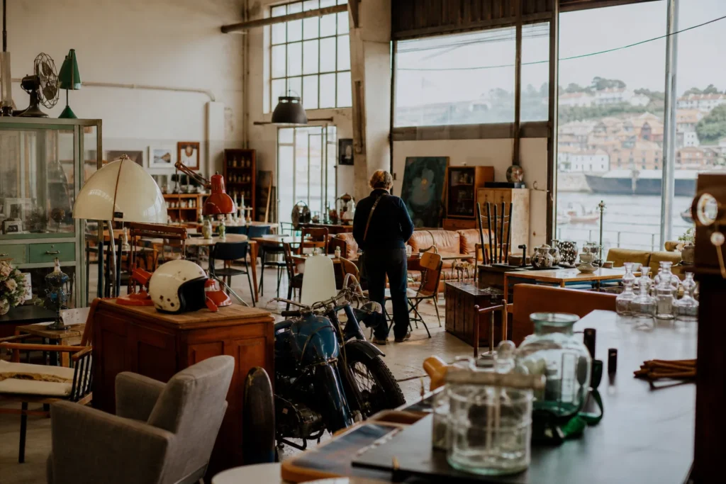 shoppers browsing antique and vintage market stalls at Armazém in Portugal