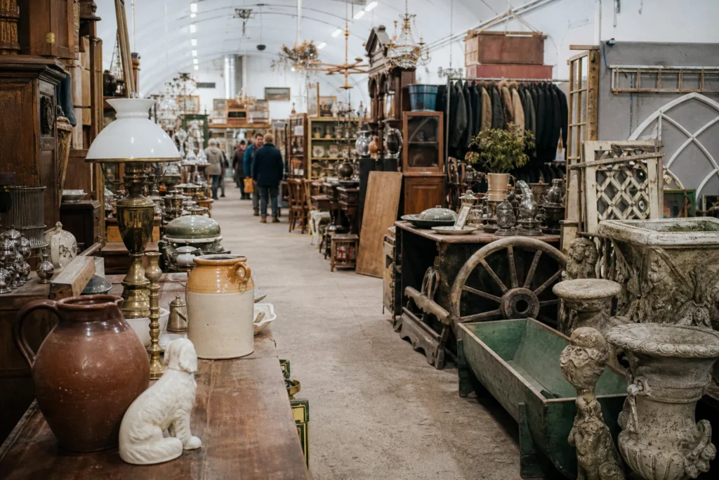shoppers browsing antique and vintage market stalls at Astra Antiques Centre in United Kingdom