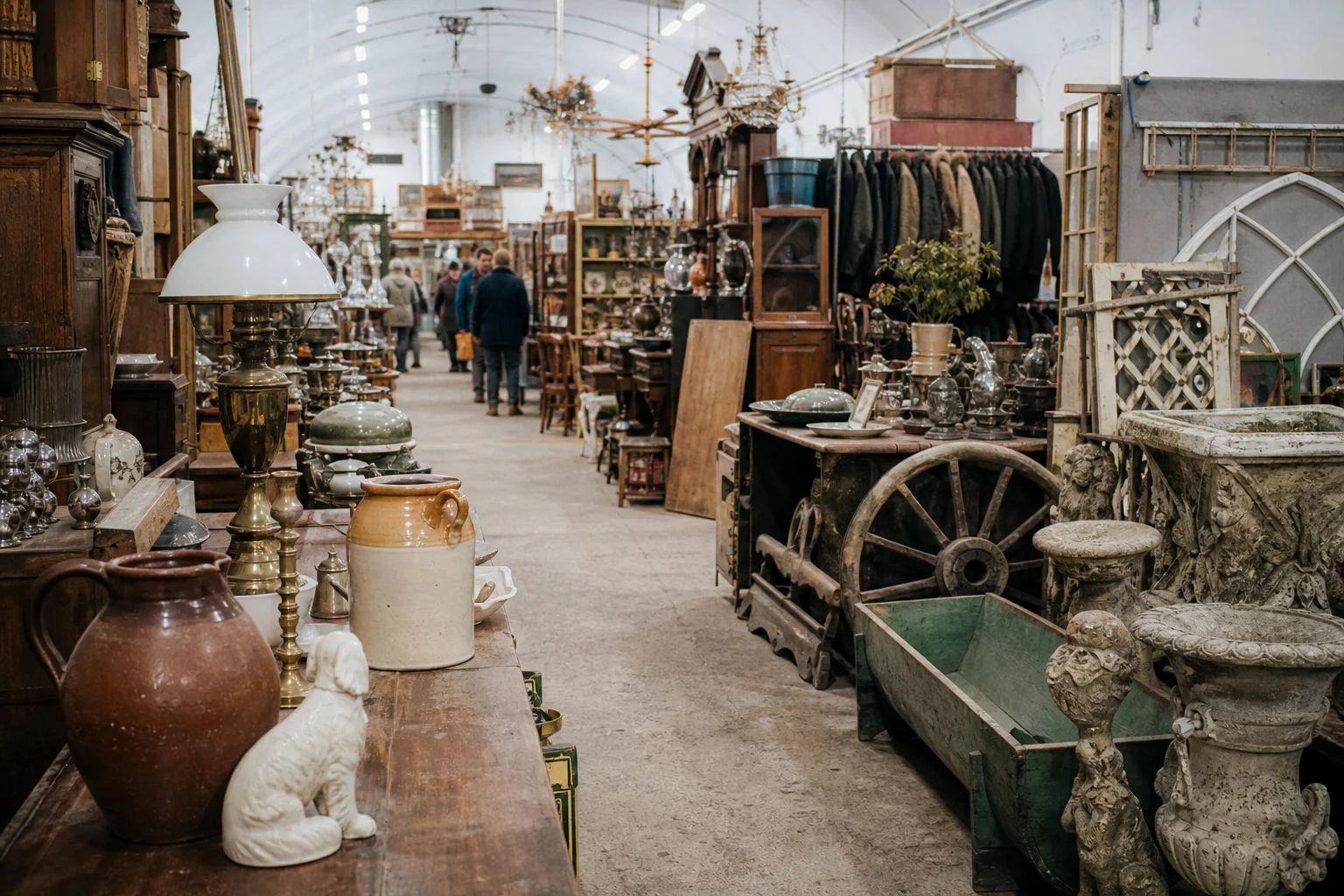 shoppers browsing antique and vintage market stalls at Astra Antiques Centre in United Kingdom