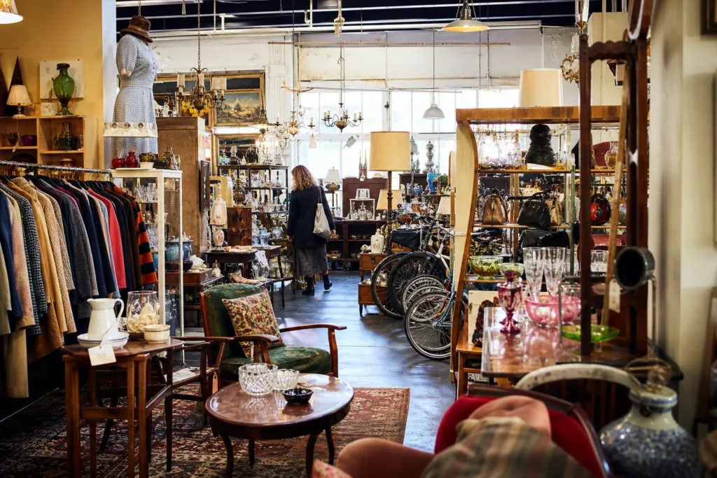 shoppers browsing antique and vintage market stalls at Bournemouth Vintage Emporium in United Kingdom