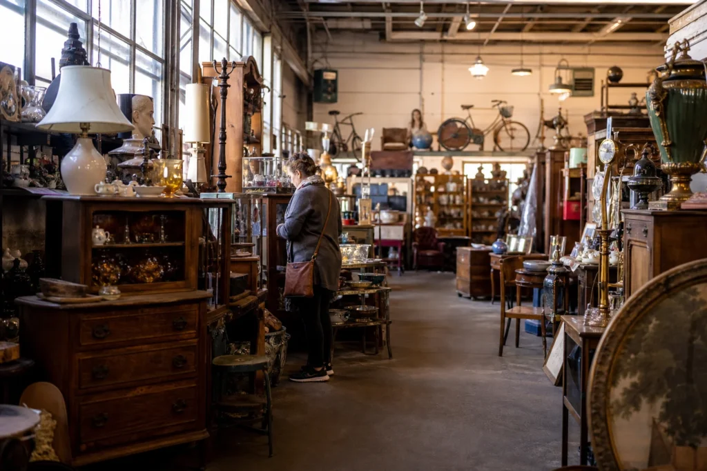 shoppers browsing antique and vintage market stalls at Brass Armadillo Antique Mall in Iowa