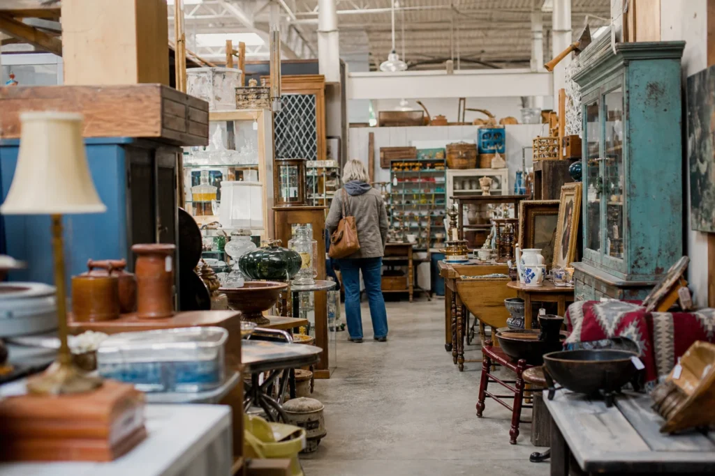 shoppers browsing antique and vintage market stalls at Brass Armadillo Antique Mall Denver in Colorado