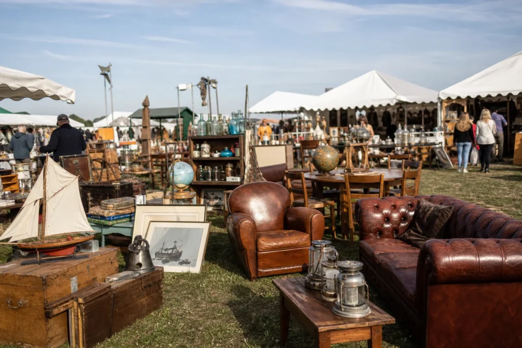 shoppers browsing antique and vintage market stalls at Broc-Ant-Stock in France