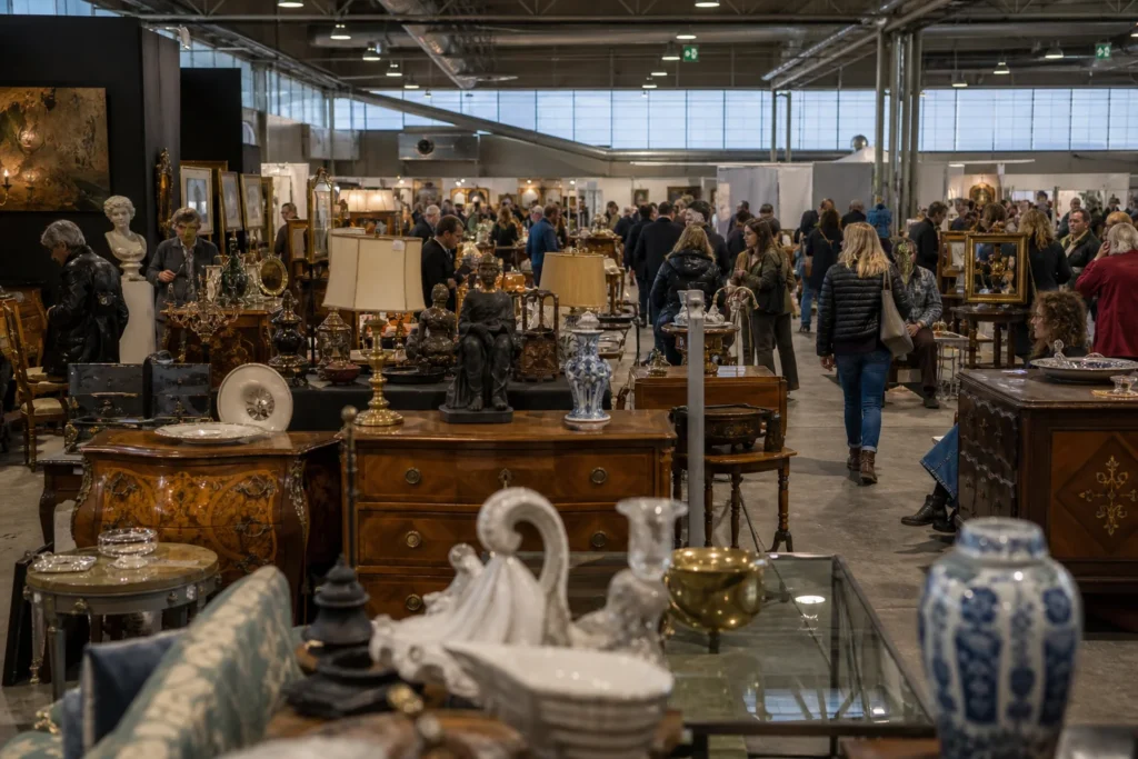 shoppers browsing antique and vintage market stalls at Brocantage Fiera dell’Antico in Italy