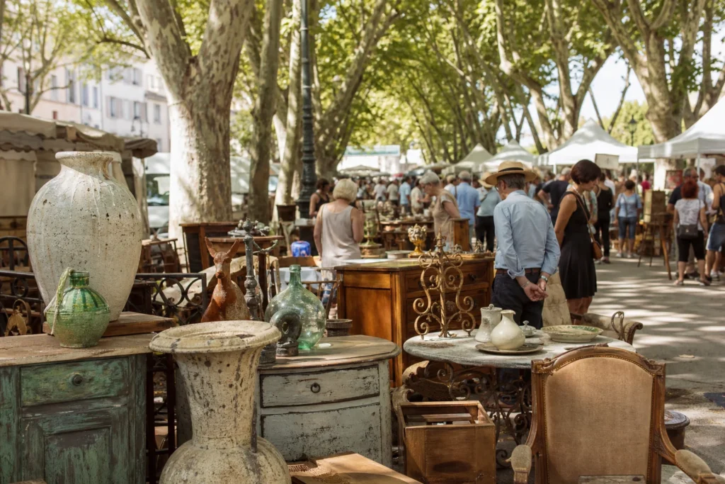 shoppers browsing antique and vintage market stalls at Brocante d’Arles in Provence