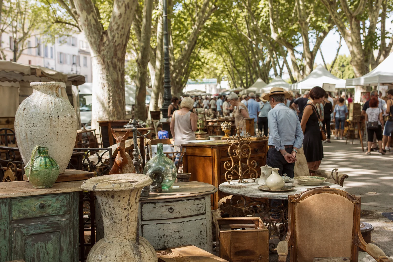 shoppers browsing antique and vintage market stalls at Brocante d’Arles in Provence
