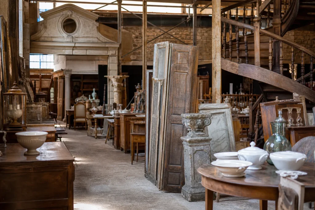 shoppers browsing antique and vintage market stalls at Brocante du Chêne Vert in France, Perche