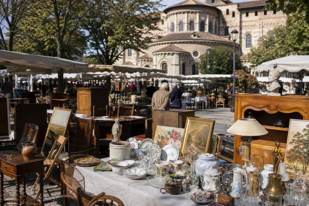 shoppers browsing antique and vintage market stalls at Brocante Saint Aubin (Saint Sernin) in France