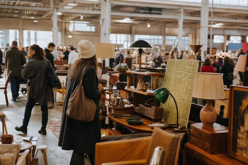 shoppers browsing antique and vintage market stalls at Brooklyn Flea Winter Market in New York City, New York State