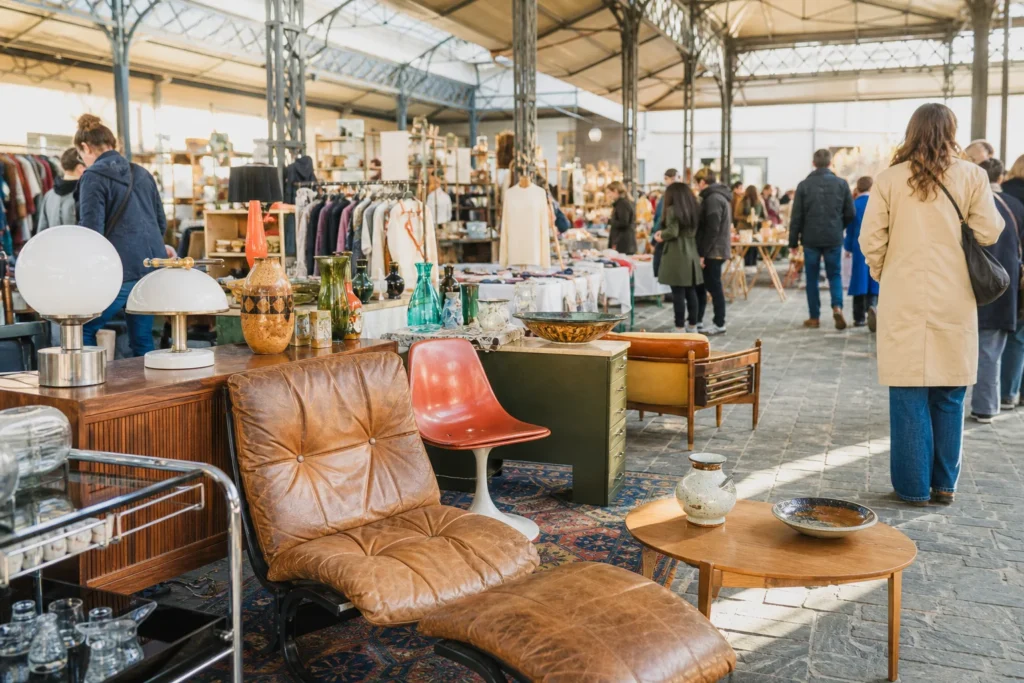 shoppers browsing antique and vintage market stalls at Brussels Vintage Market in Belgium