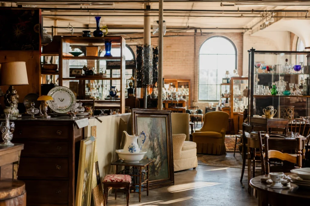 shoppers browsing antique and vintage market stalls at Cabot Mill Antiques in Maine