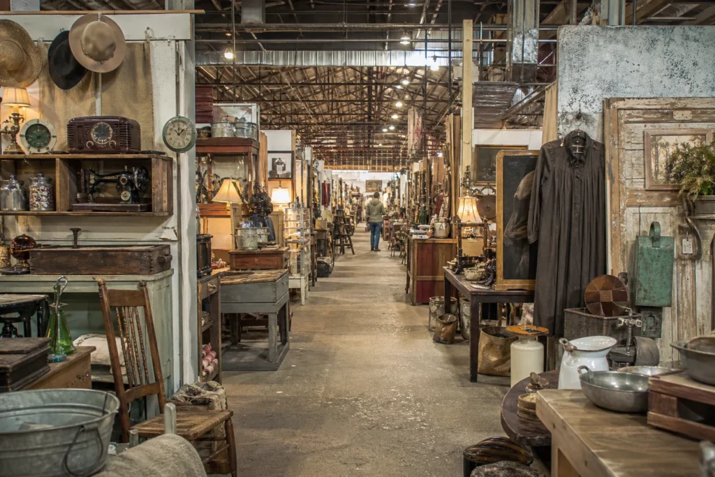 shoppers browsing antique and vintage market stalls at Camp Flea Antique Mall in Missouri