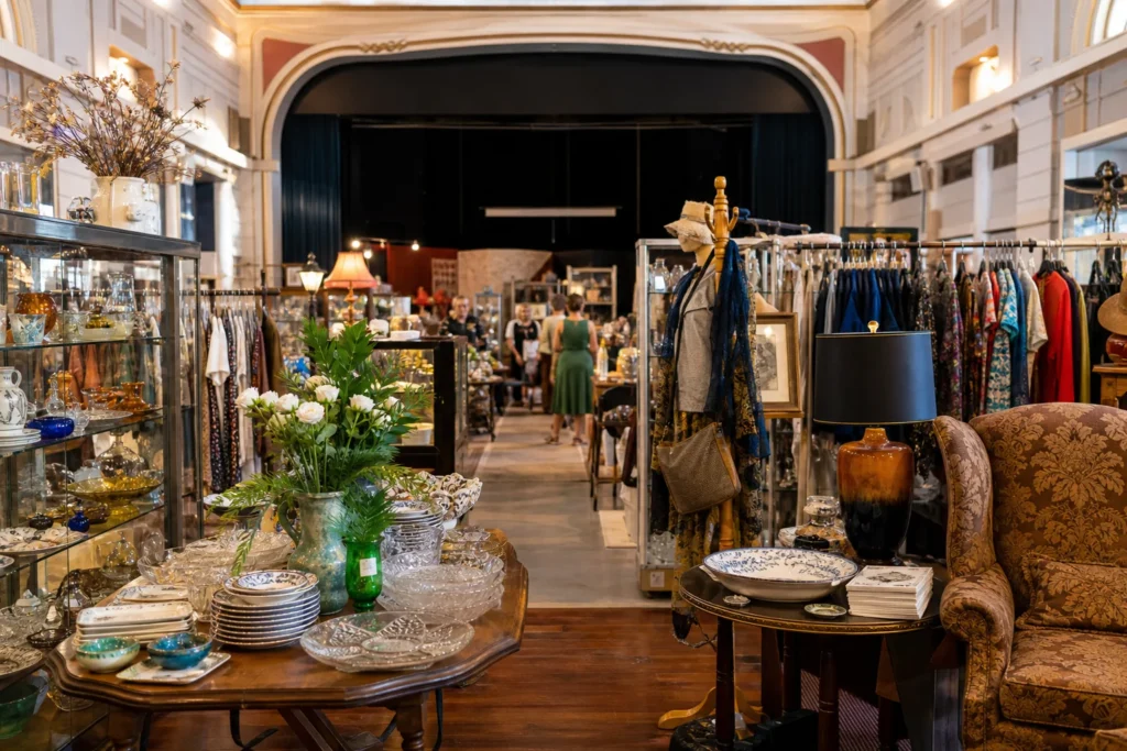 shoppers browsing antique and vintage market stalls at Camp Hill Antique Center in Brisbane, Queensland