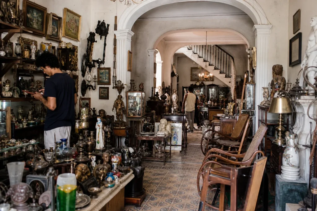 shoppers browsing antique and vintage market stalls at Casa Belkis in Cuba