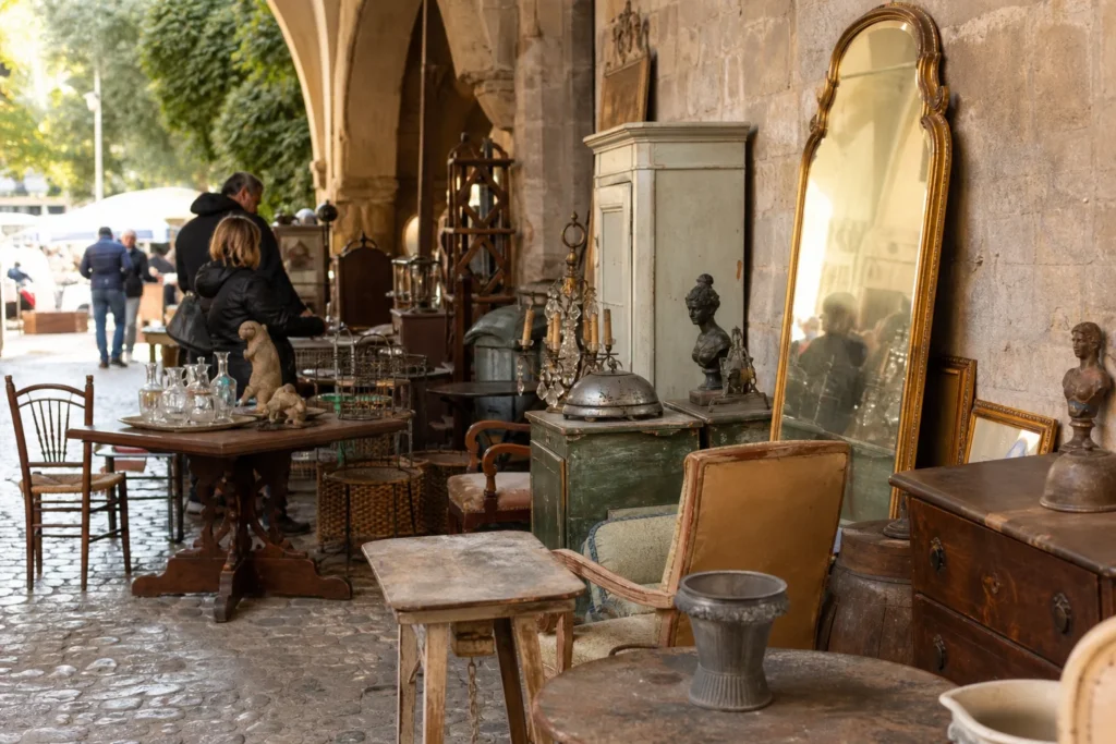 shoppers browsing antique and vintage market stalls at Chairish in Place Charles David, 30400 Villeneuve-lès-Avignon, France