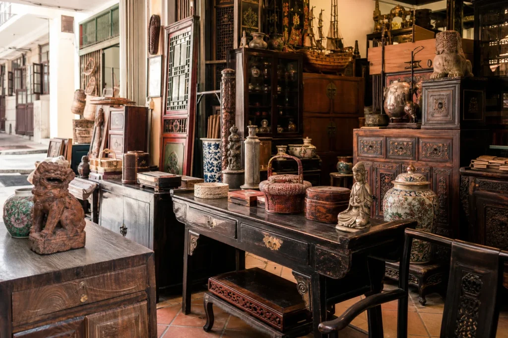 shoppers browsing antique and vintage market stalls at Chinatown Treasures Concessionaire in Malaysia