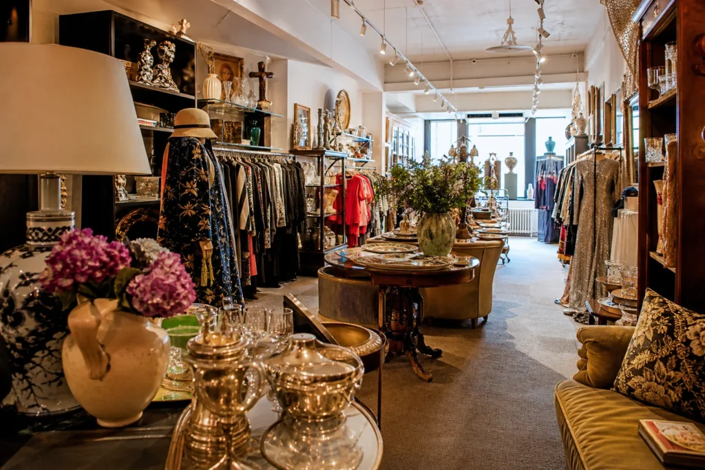 shoppers browsing antique and vintage market stalls at City Opera Thrift Shop in New York City