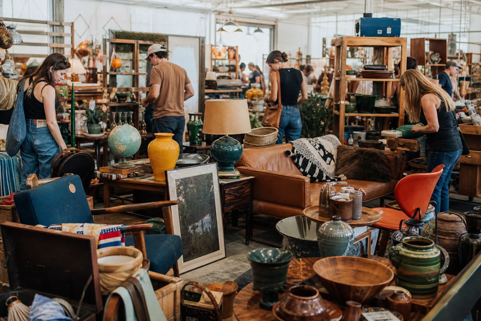 shoppers browsing antique and vintage market stalls at City Wide Garage Sale in Texas