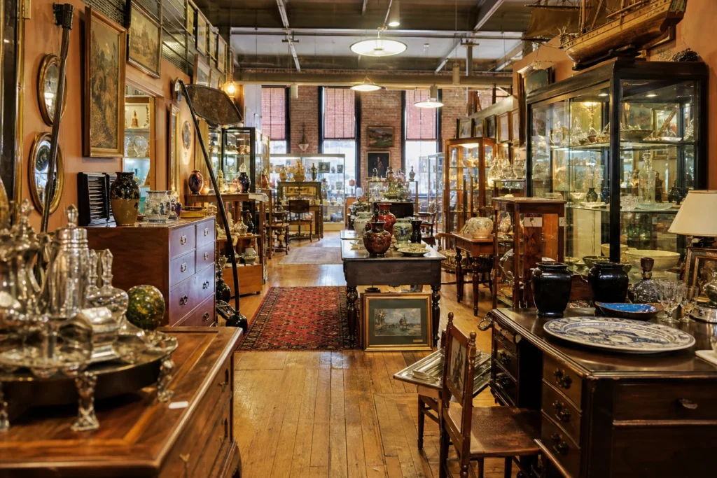 shoppers browsing antique and vintage market stalls at Concord Antiques in New Hampshire