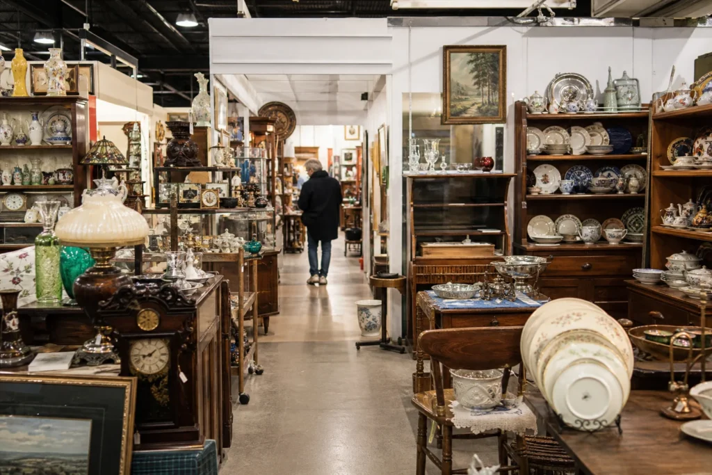 shoppers browsing antique and vintage market stalls at Days of Olde Antiques in New Jersey
