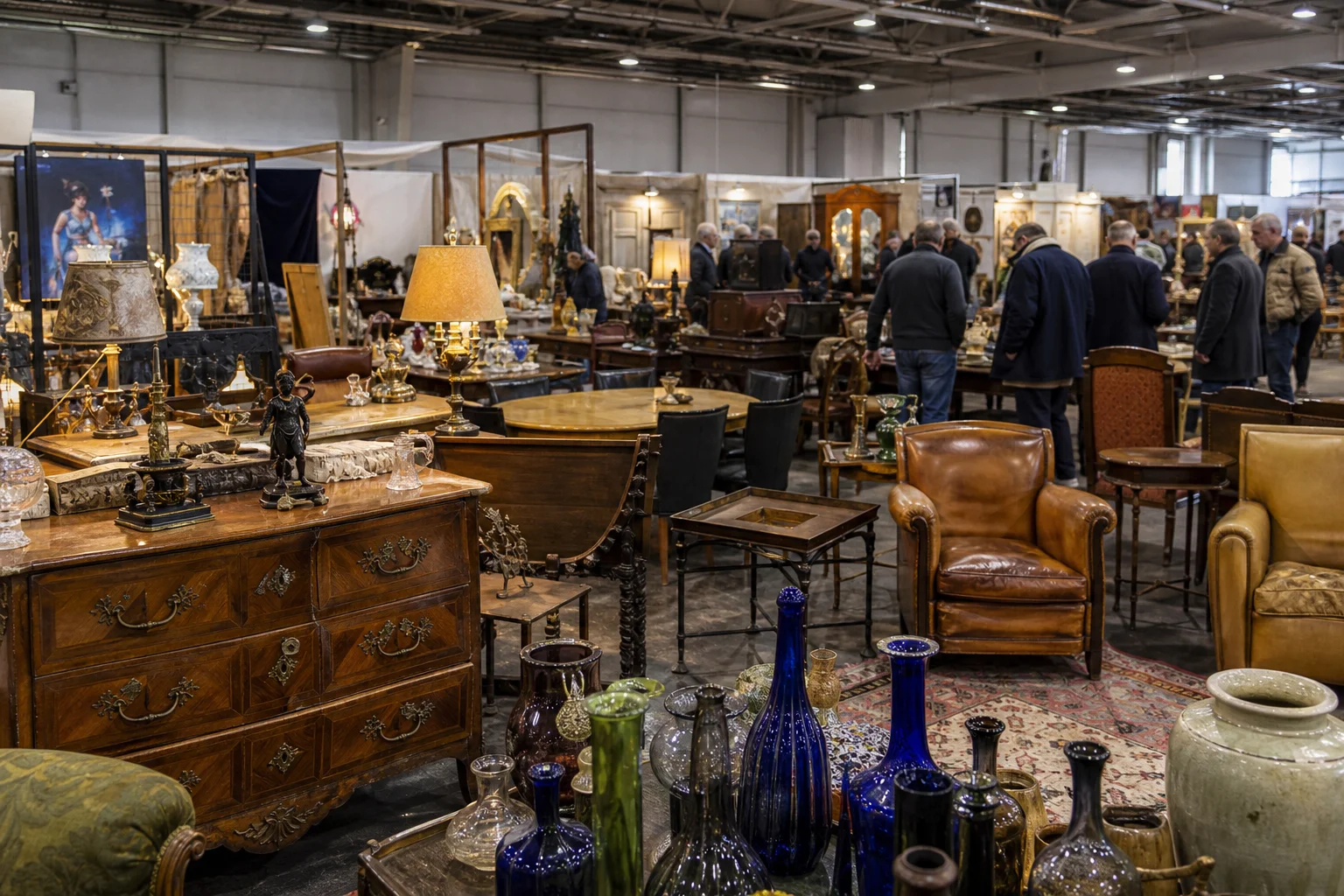 shoppers browsing antique and vintage market stalls at Déballage Marchand International de Chartres in France