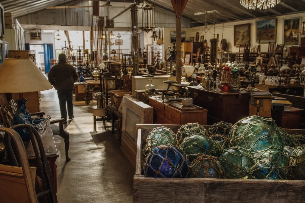 shoppers browsing antique and vintage market stalls at Duane’s Antique Market in Alaska