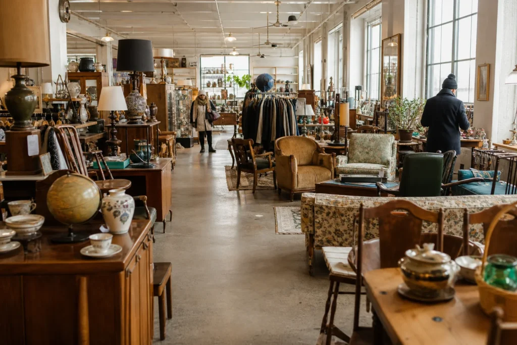 shoppers browsing antique and vintage market stalls at Eco Depot Montréal in Canada, Montreal, Quebec