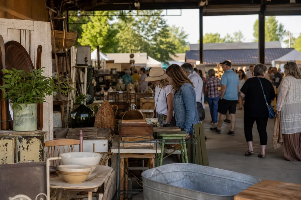 shoppers browsing antique and vintage market stalls at Farm Chicks Show in Washington