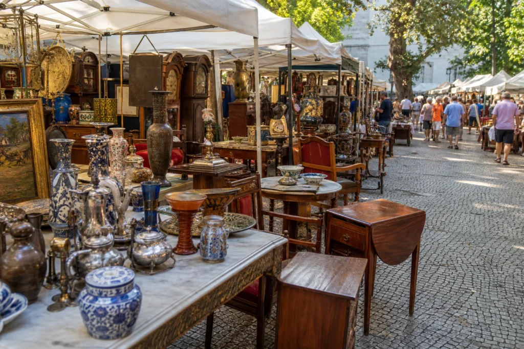 shoppers browsing antique and vintage market stalls at Feira de Antiguidades da Gávea in Brazil