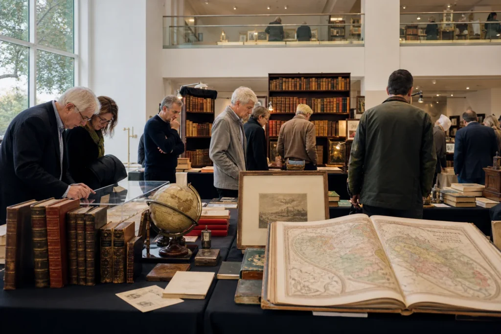 shoppers browsing antique and vintage market stalls at Firsts London