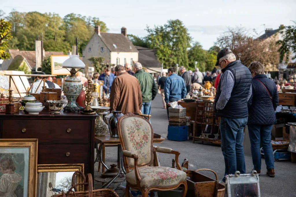 shoppers browsing antique and vintage market stalls at Foire à la brocante de Brion in France