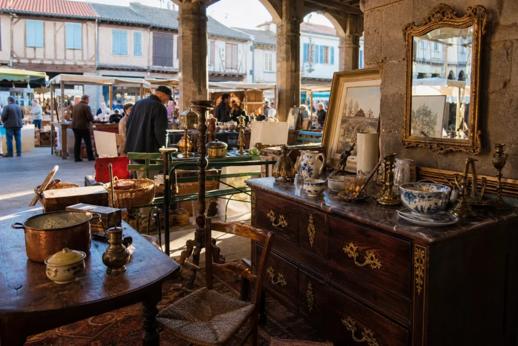 shoppers browsing antique and vintage market stalls at Foire à la Brocante de Mirepoix in France
