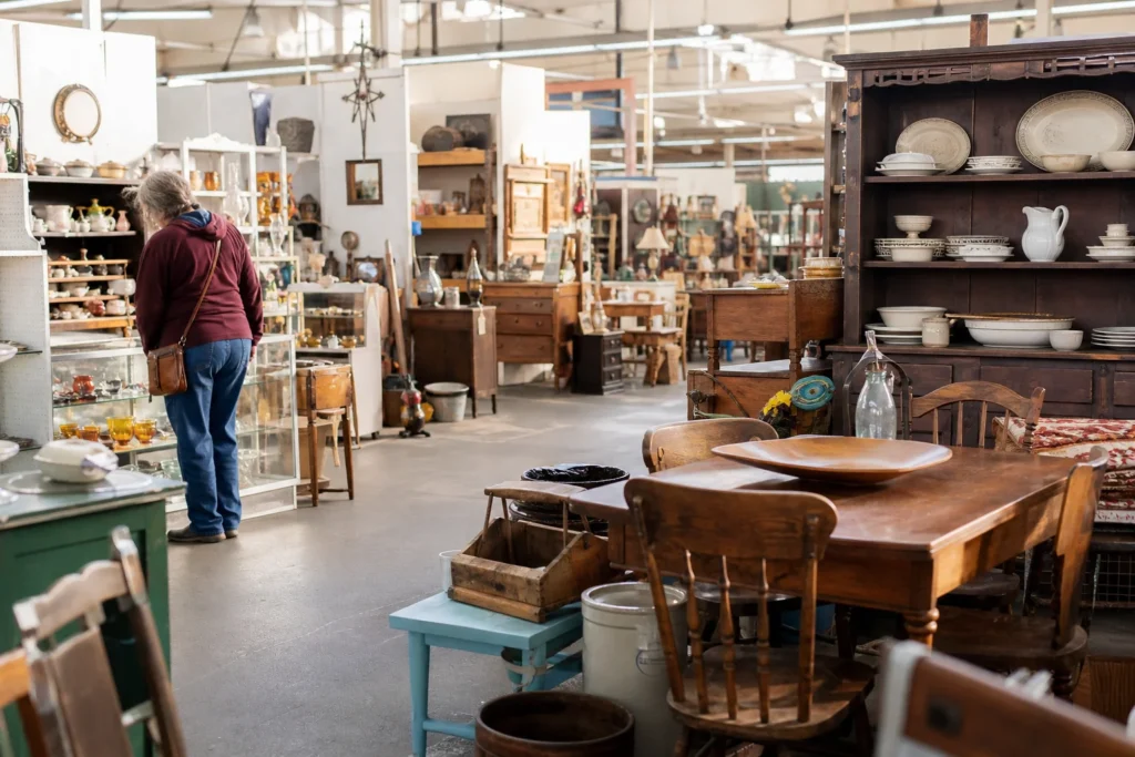 shoppers browsing antique and vintage market stalls at Foothills Flea Market in Colorado