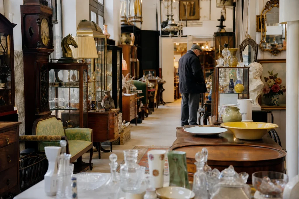 shoppers browsing antique and vintage market stalls at Glasgow City Antiques in United Kingdom