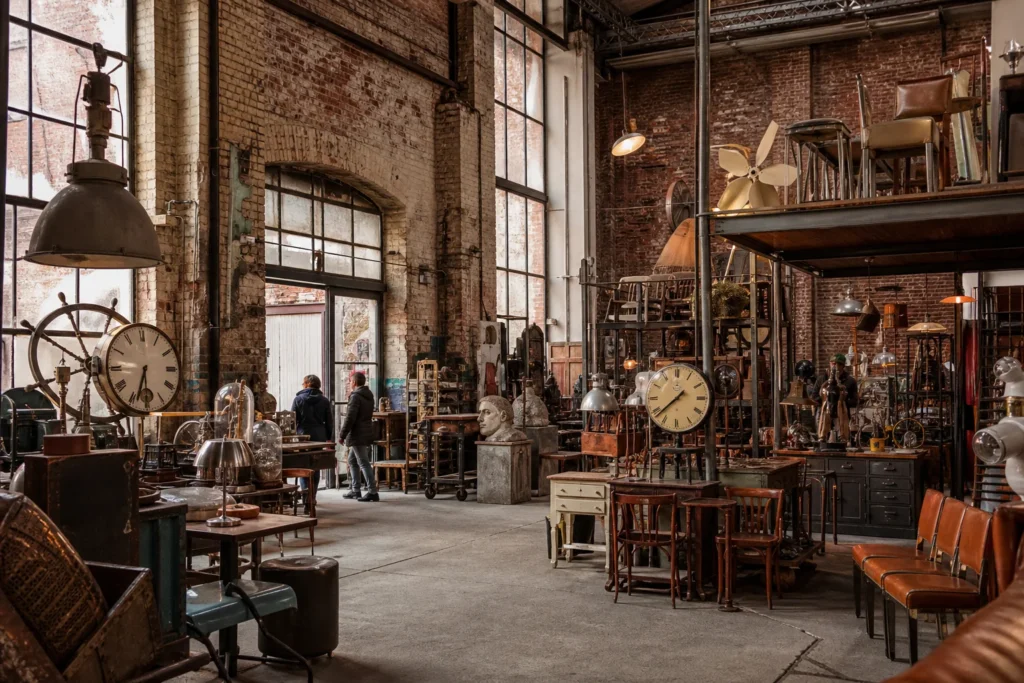 shoppers browsing antique and vintage market stalls at Good Old Goods in Berlin, Germany