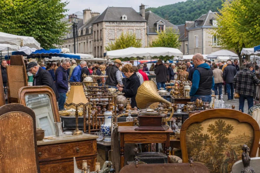 shoppers browsing antique and vintage market stalls at Grande Foire à Tout des Andelys in France