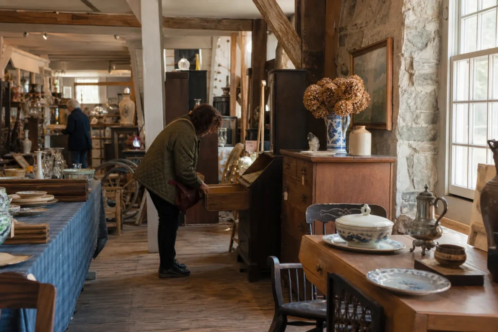 shoppers browsing antique and vintage market stalls at Grist Mill Antiques Center in New Jersey
